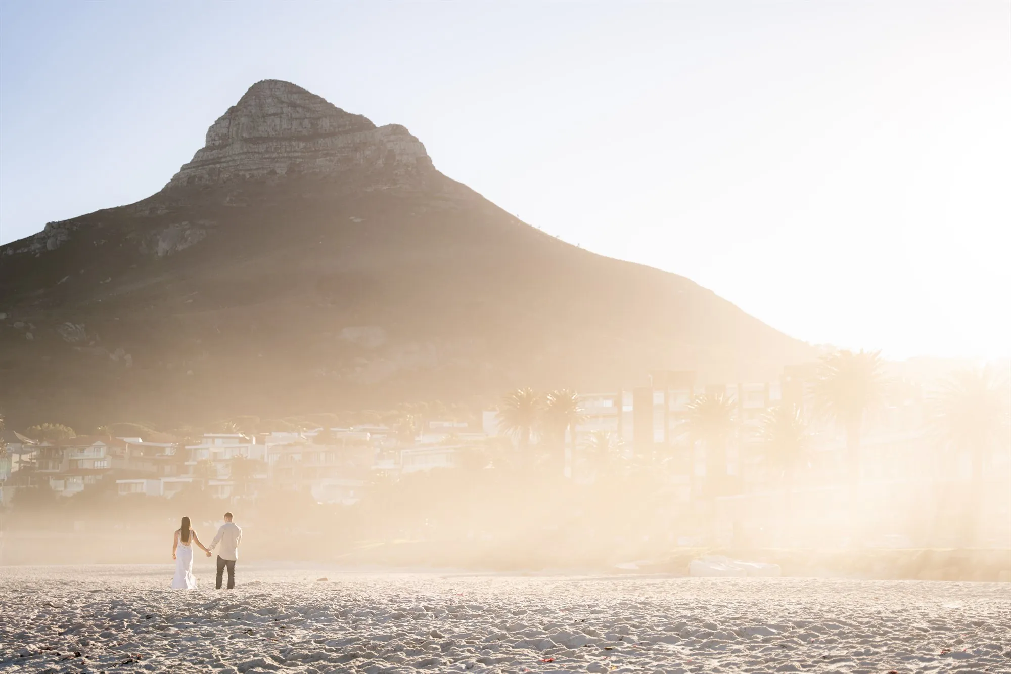 A couple at Camps Bay, Lion's Head behind