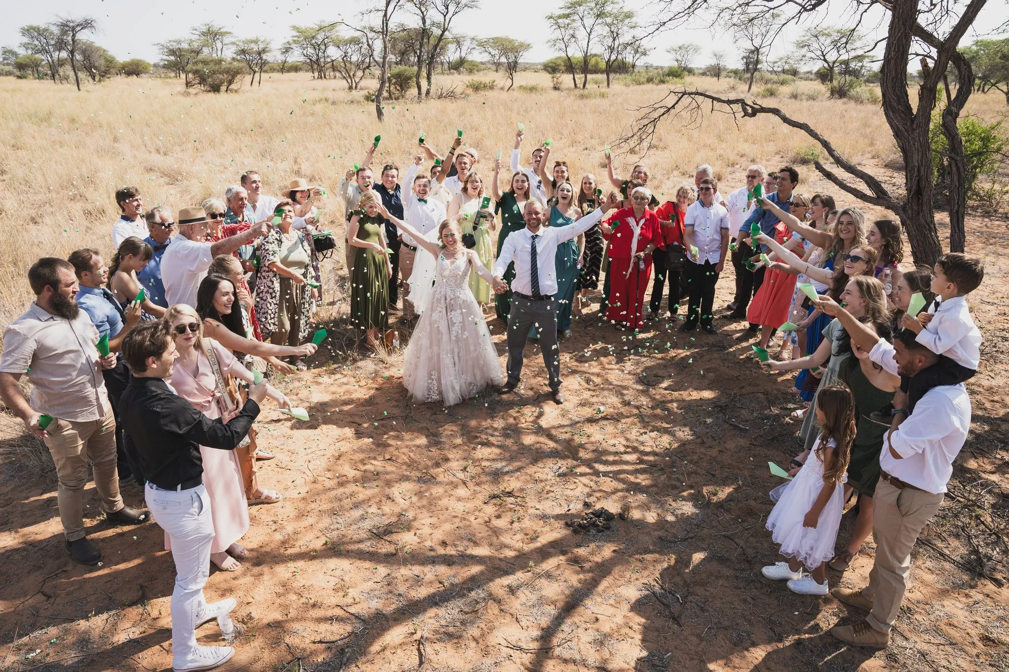 Guests closing in a circle around the newly married couple
