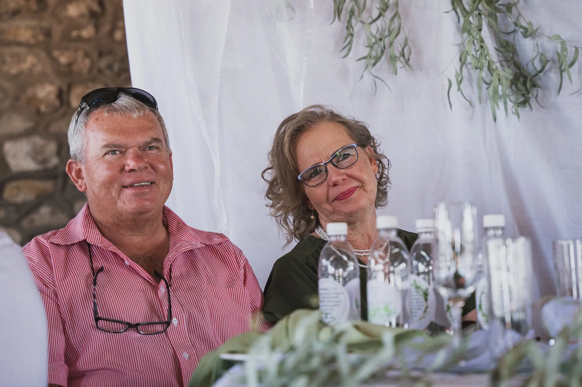 Two guests smiling at the reception table