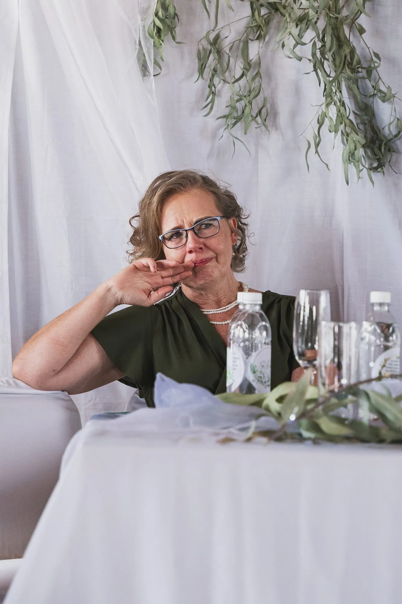 A guest wiping away a tear during the speeches