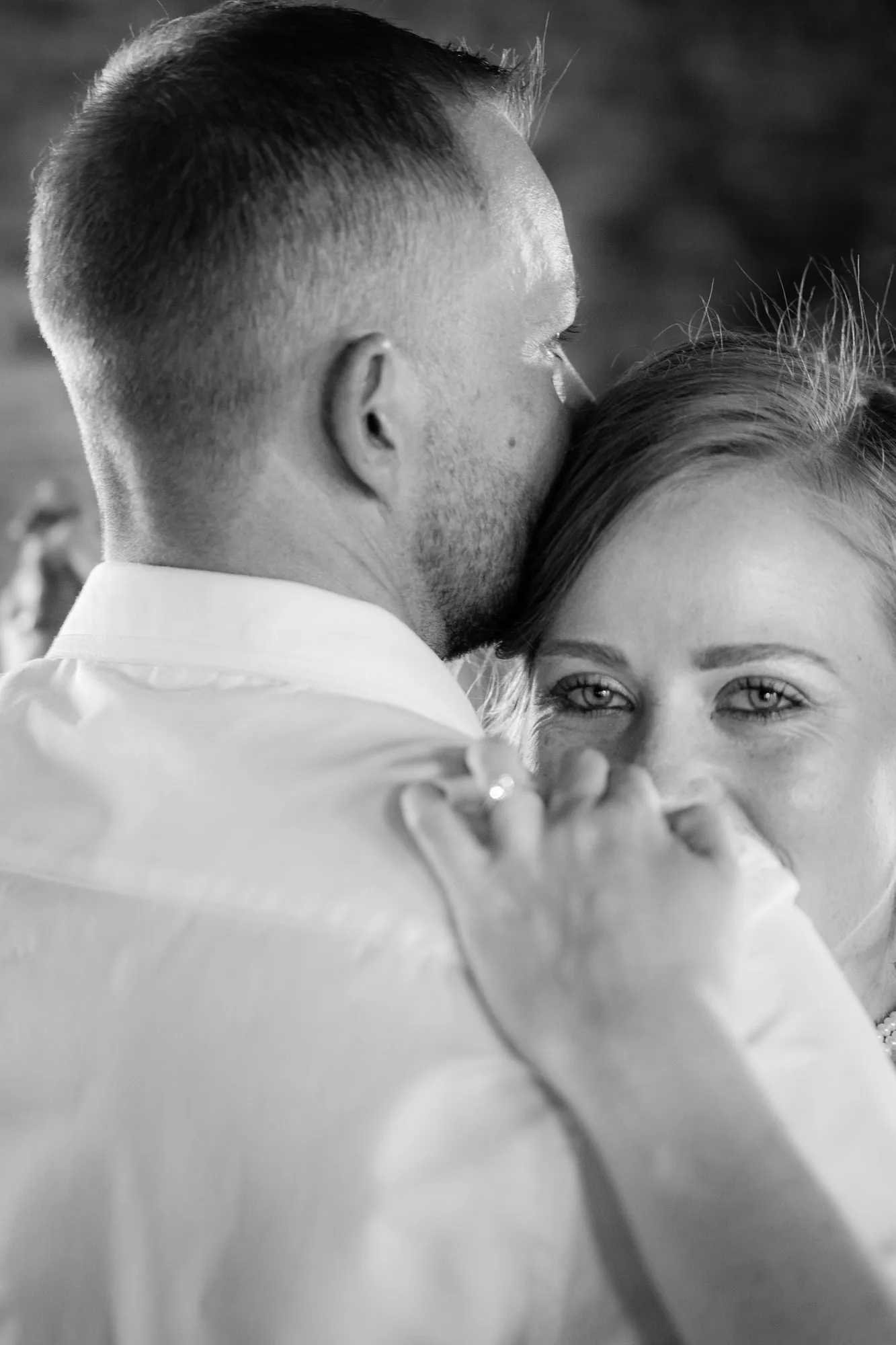 A couple in a quiet embrace, in black and white