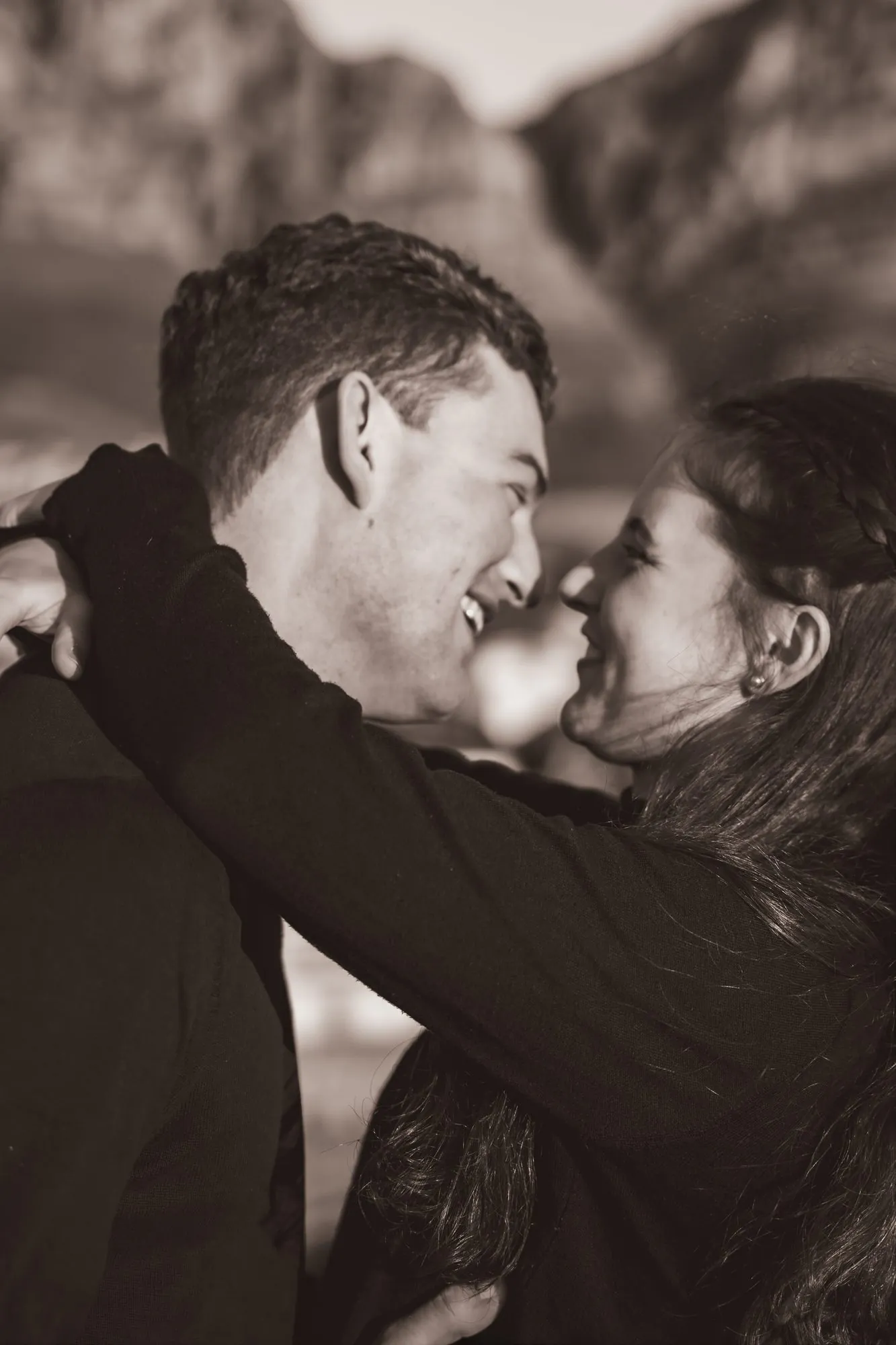 Couple embracing during their engagement shoot
