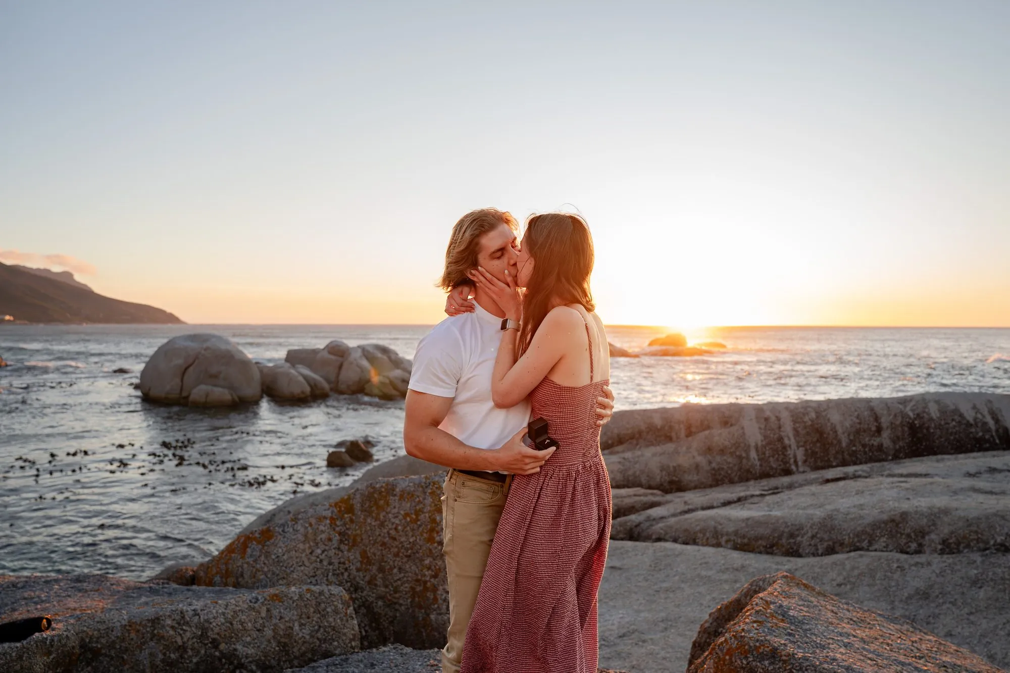Engaged couple together at golden hour