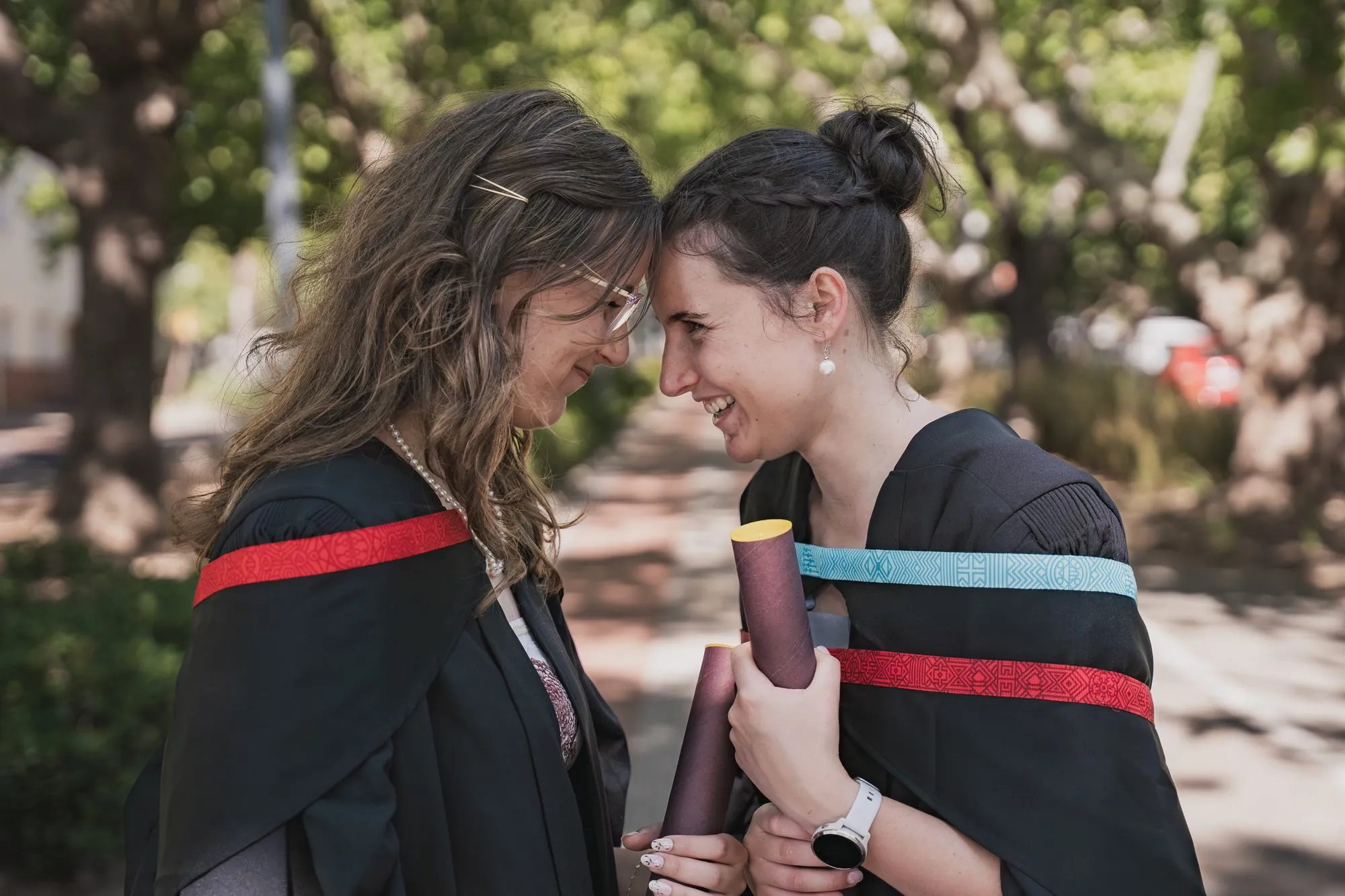 Two graduates laughing together in Stellenbosch