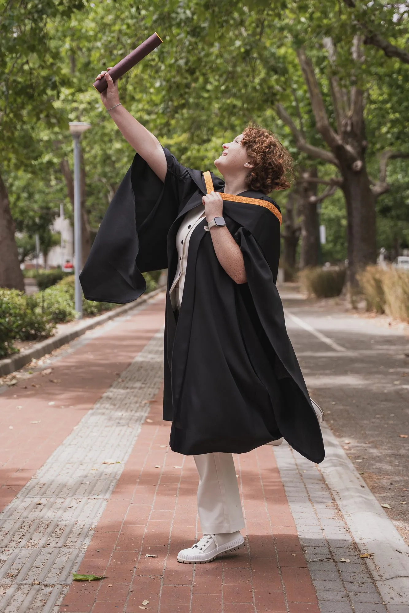 Graduate celebrating on graduation day