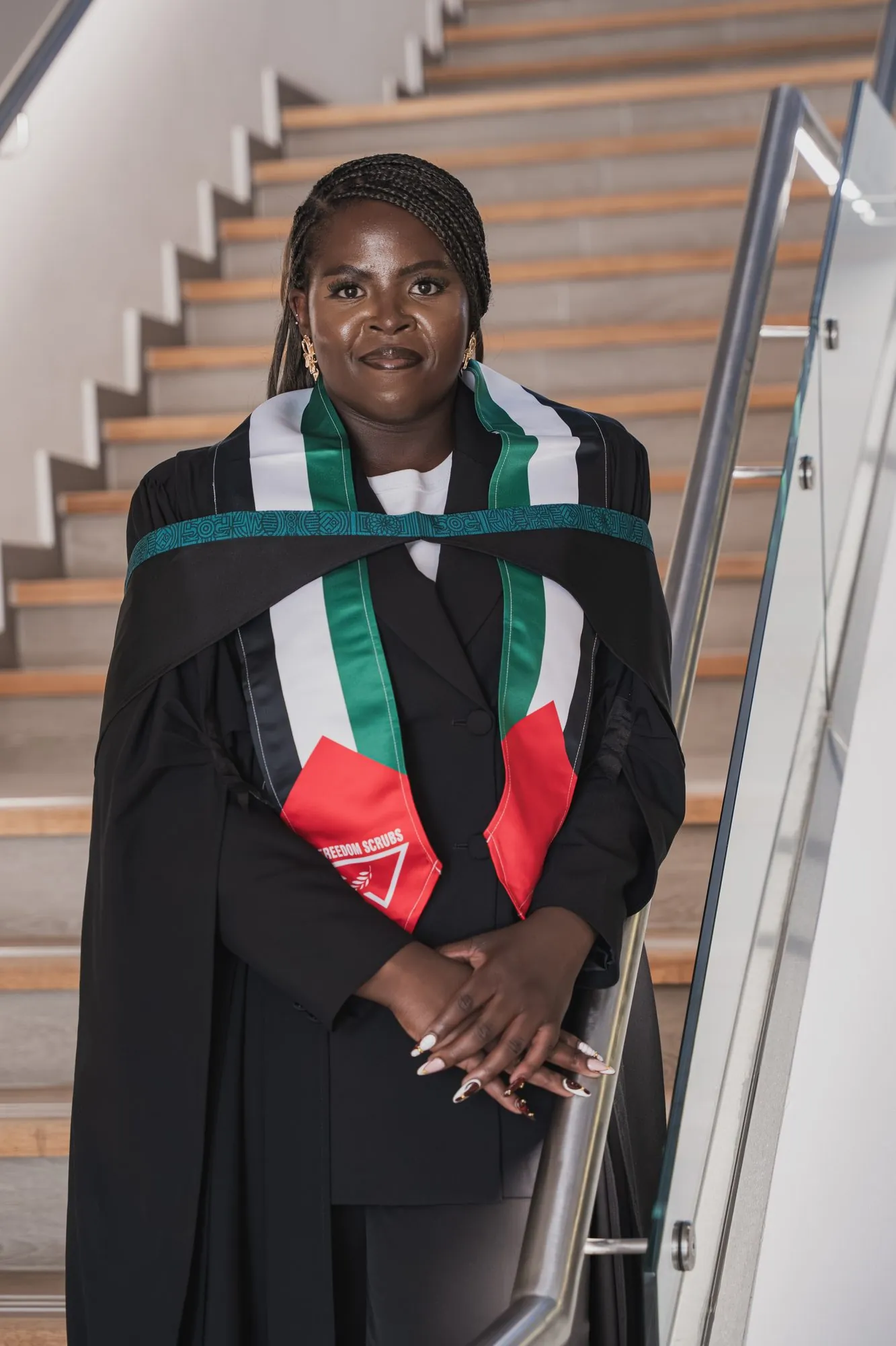 A graduate with her scroll after the ceremony