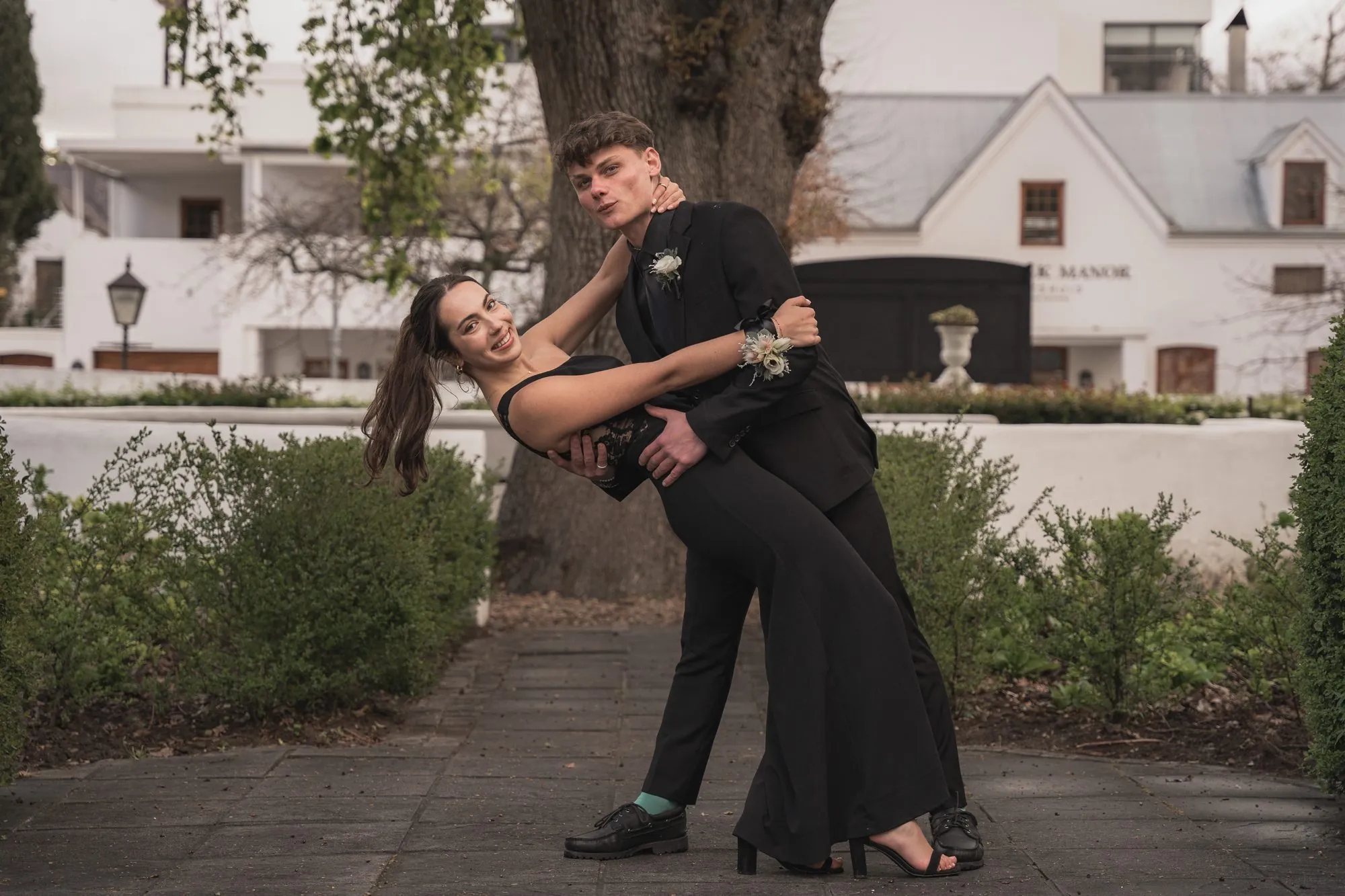 Matric dance couple dancing in a garden