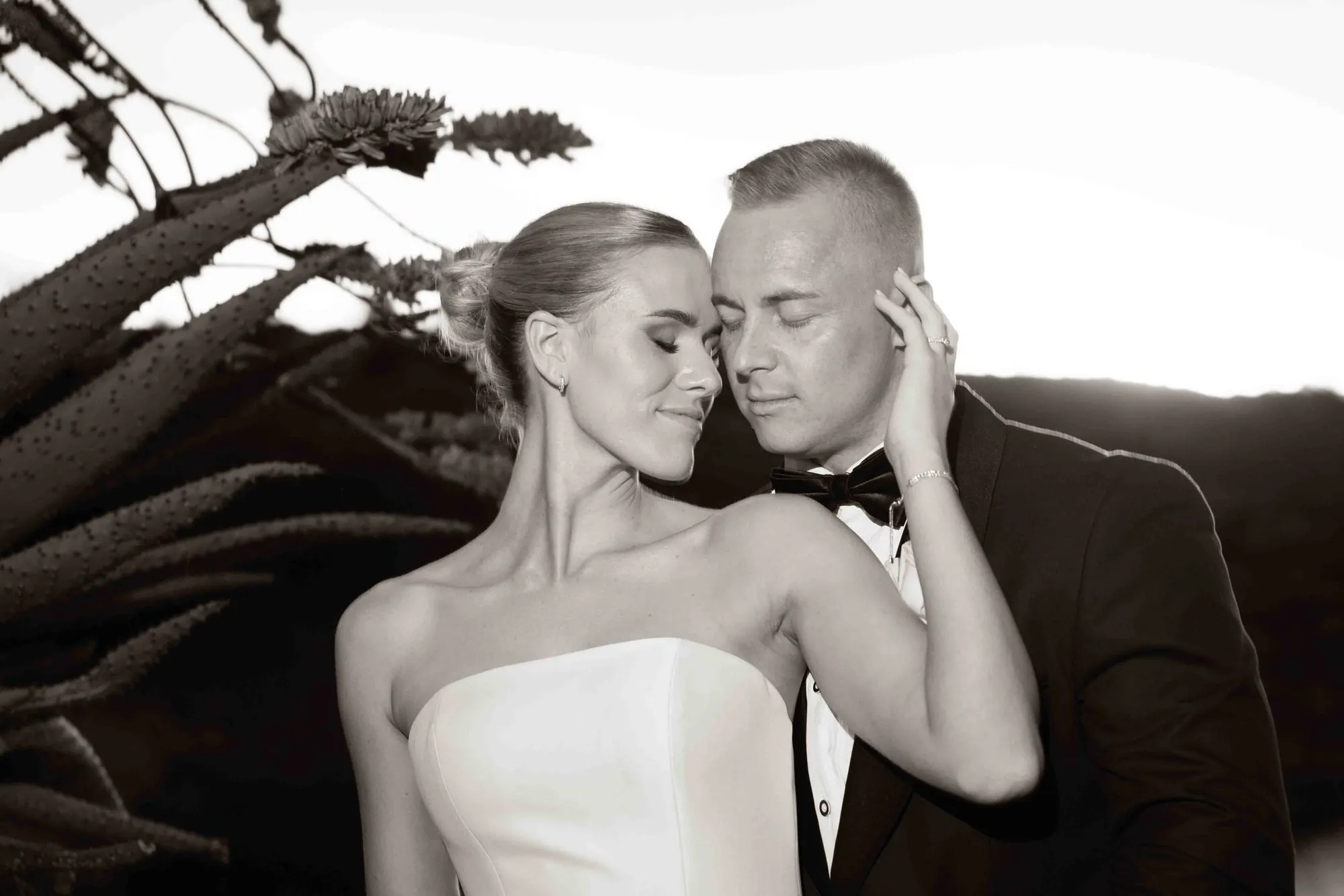 A couple cheek to cheek, in black and white